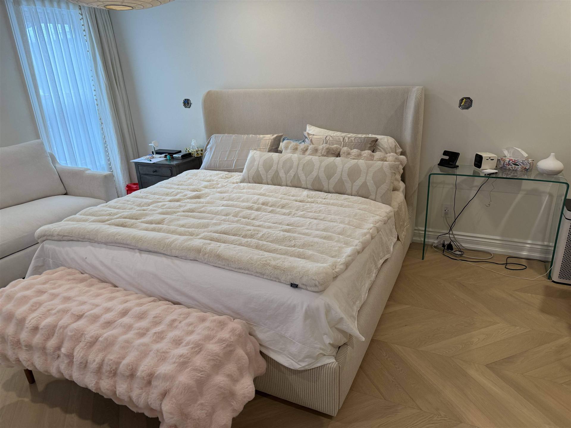 Cream wingback bed in styled bedroom