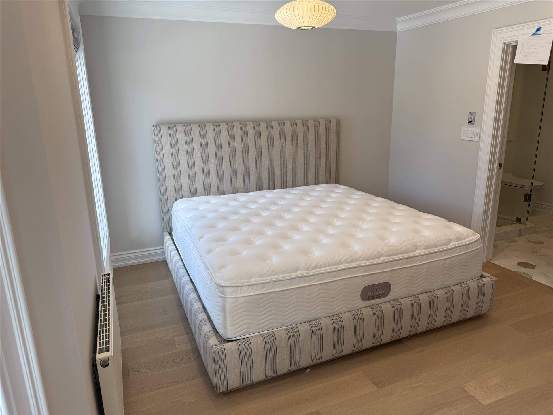 Stripe upholstered bed in grey room