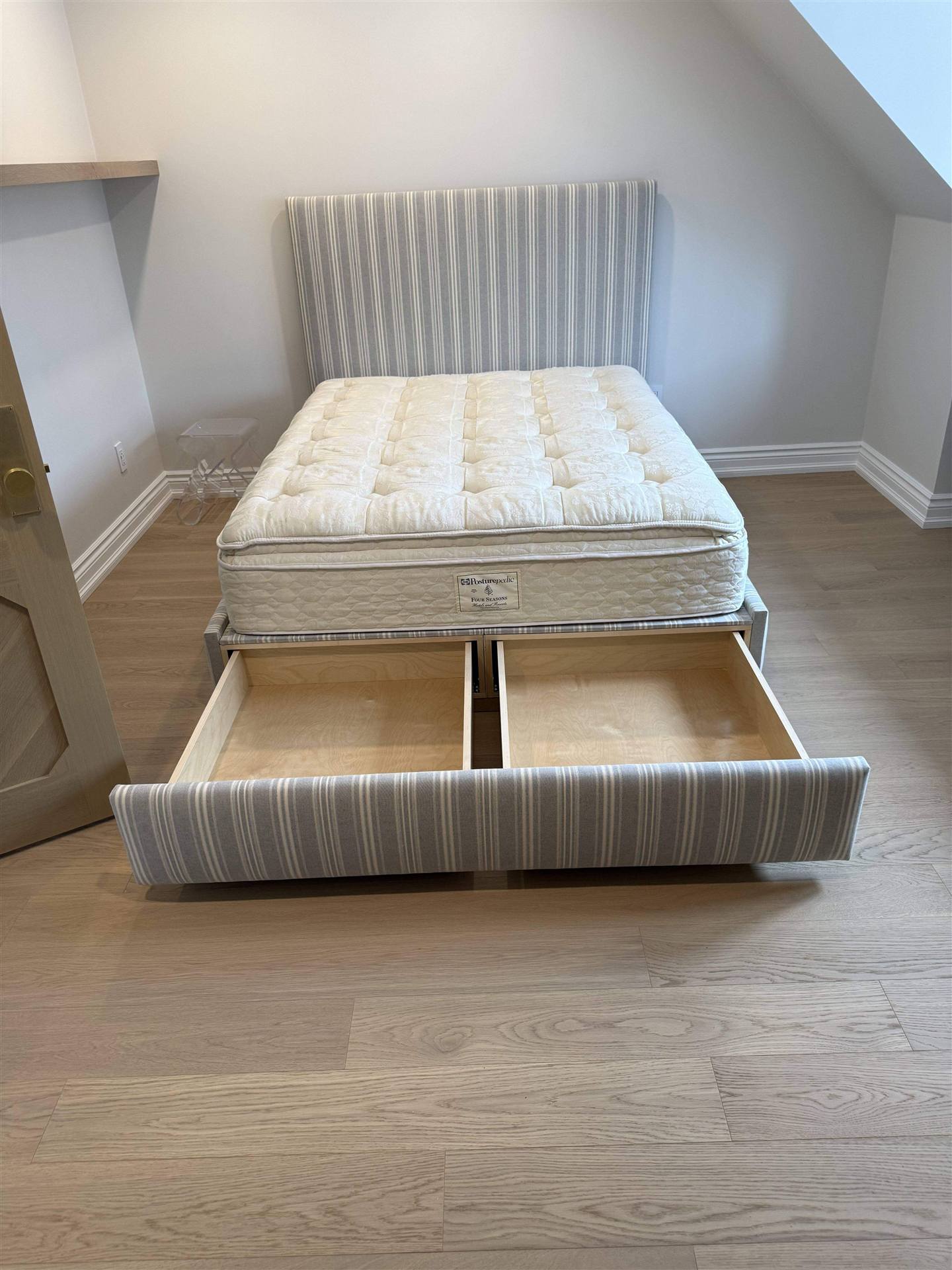 Custom stripe upholstered bed with open storage compartments