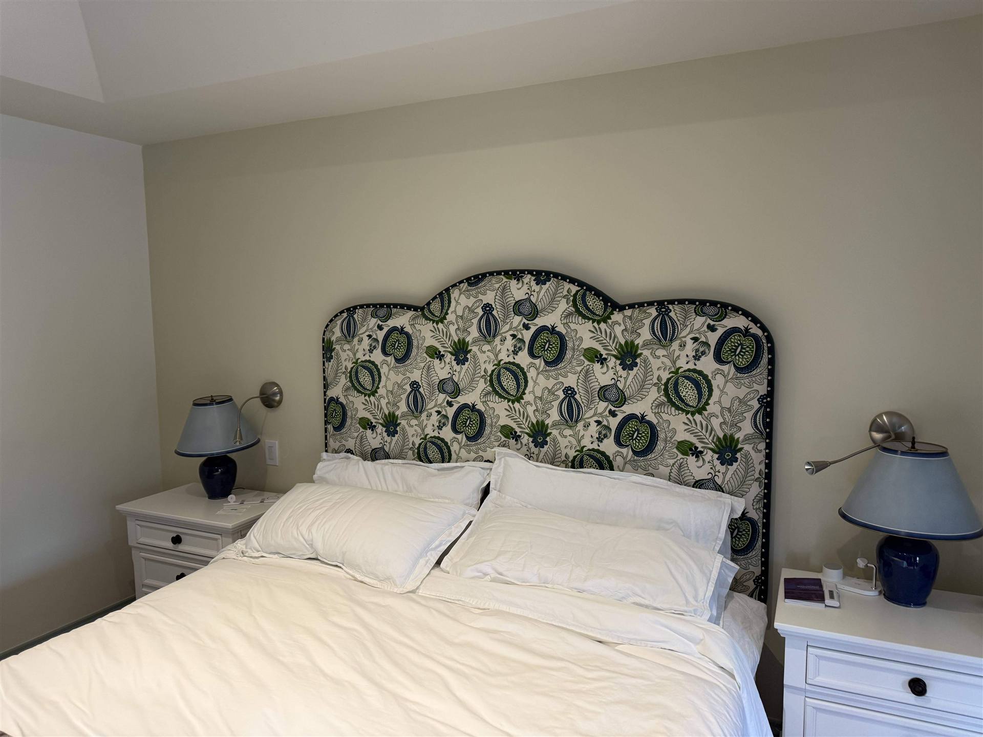 Custom floral print upholstered headboard with navy botanical pattern