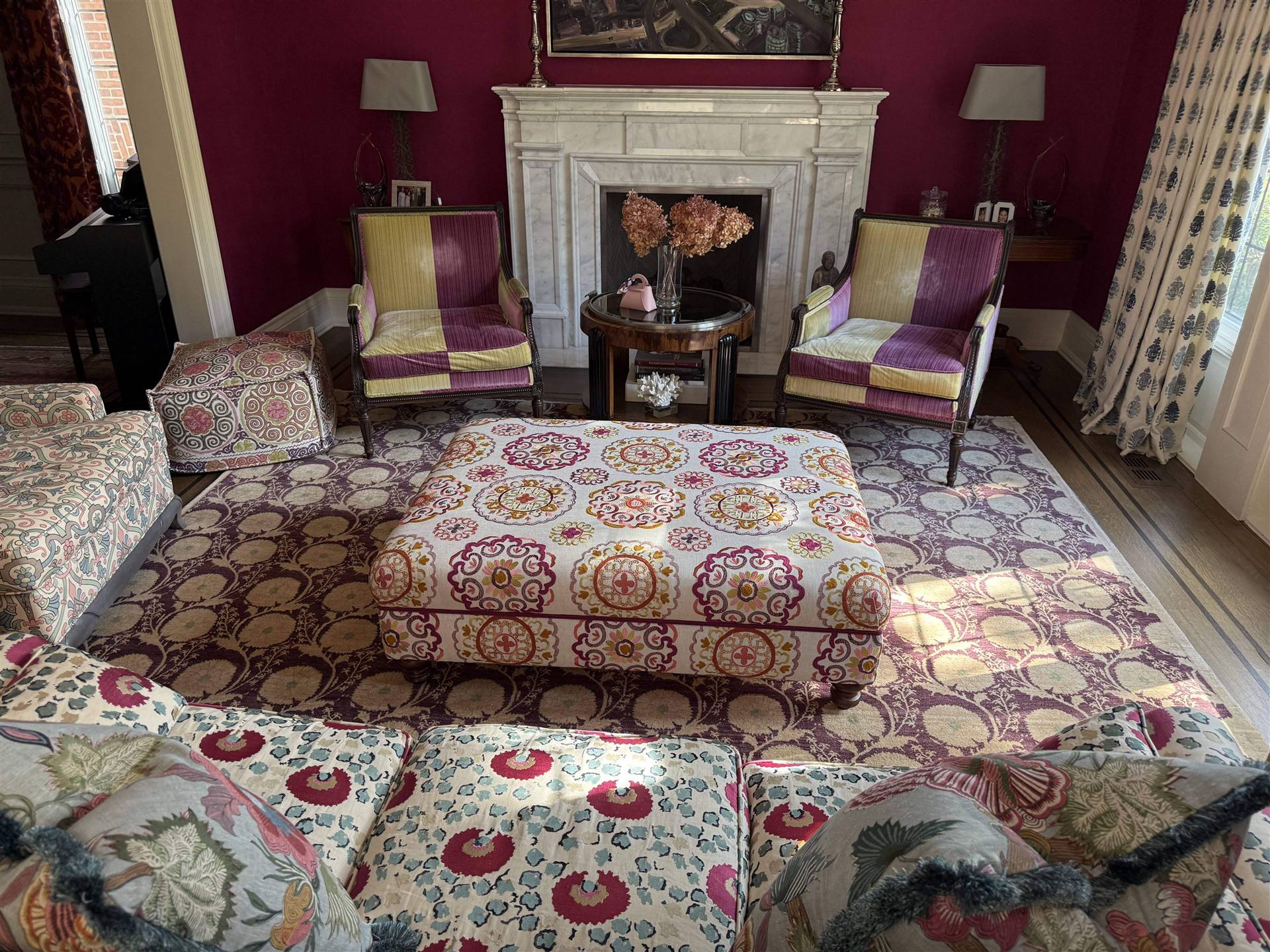 Custom medallion print upholstered ottoman in bold pattern living room